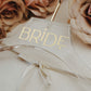 Acrylic wedding dress hanger with personalized name, available in a variety of text colors