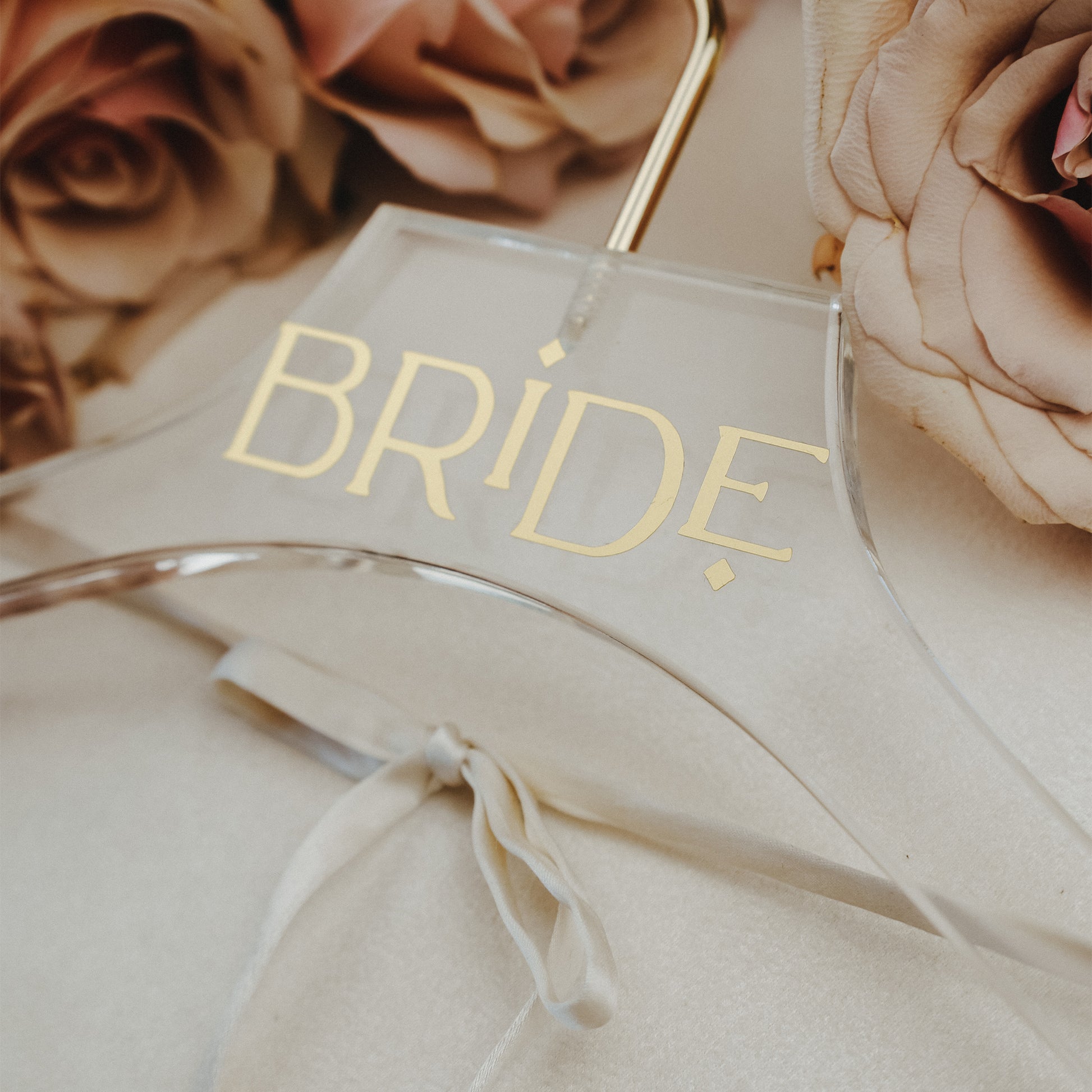 Acrylic wedding dress hanger with personalized name, available in a variety of text colors