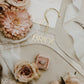 Personalized acrylic hanger for wedding dresses, displaying a name in your choice of gold, silver, white, black, rose gold, or champagne lettering