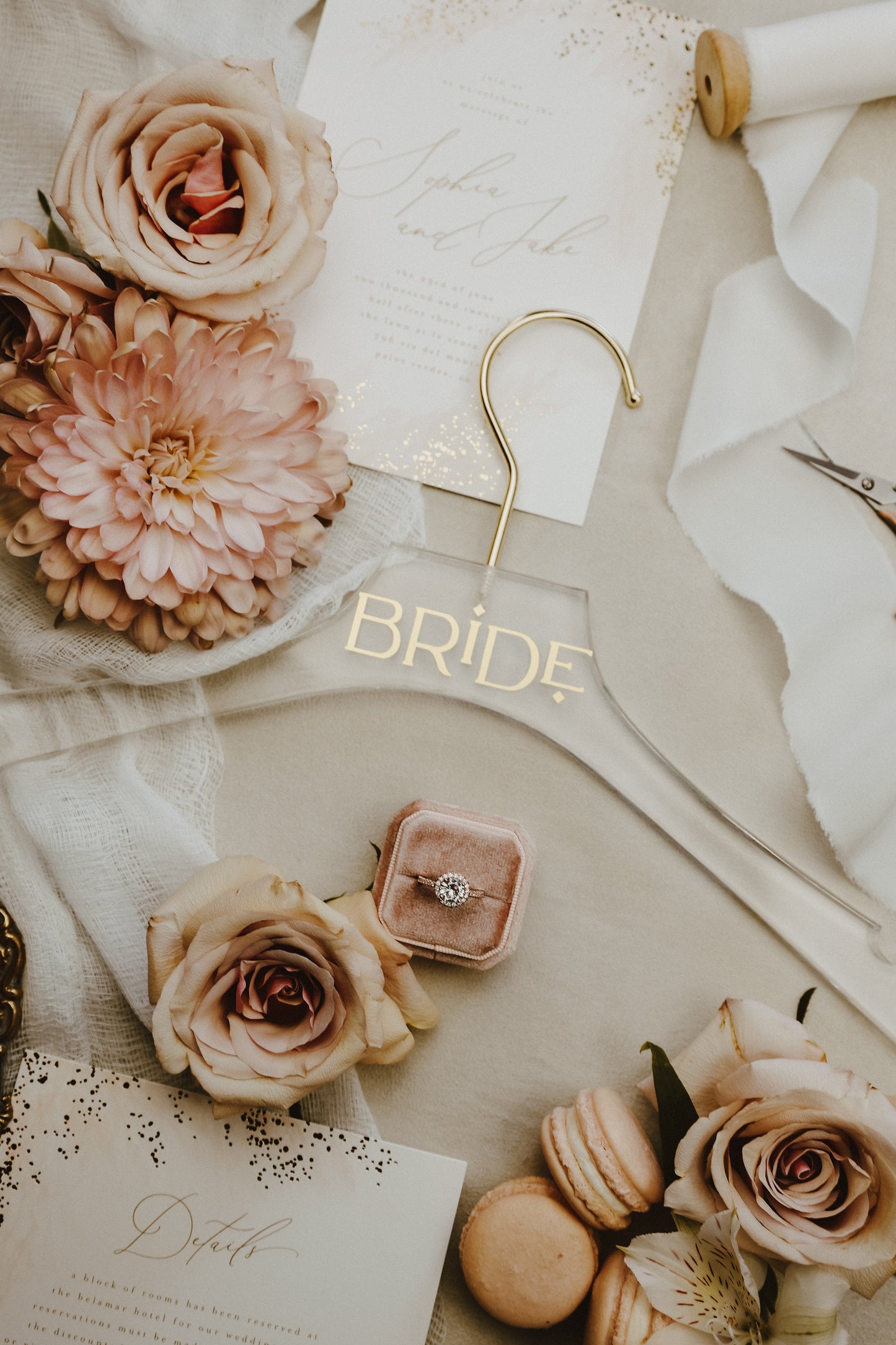 Personalized acrylic hanger for wedding dresses, displaying a name in your choice of gold, silver, white, black, rose gold, or champagne lettering