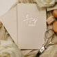 Soft touch cover vow books, handmade and personalized with foiled bride and groom names and wedding date.