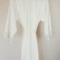 Soft velvet robe with lace sleeve accents, designed to pamper the bride on her special day