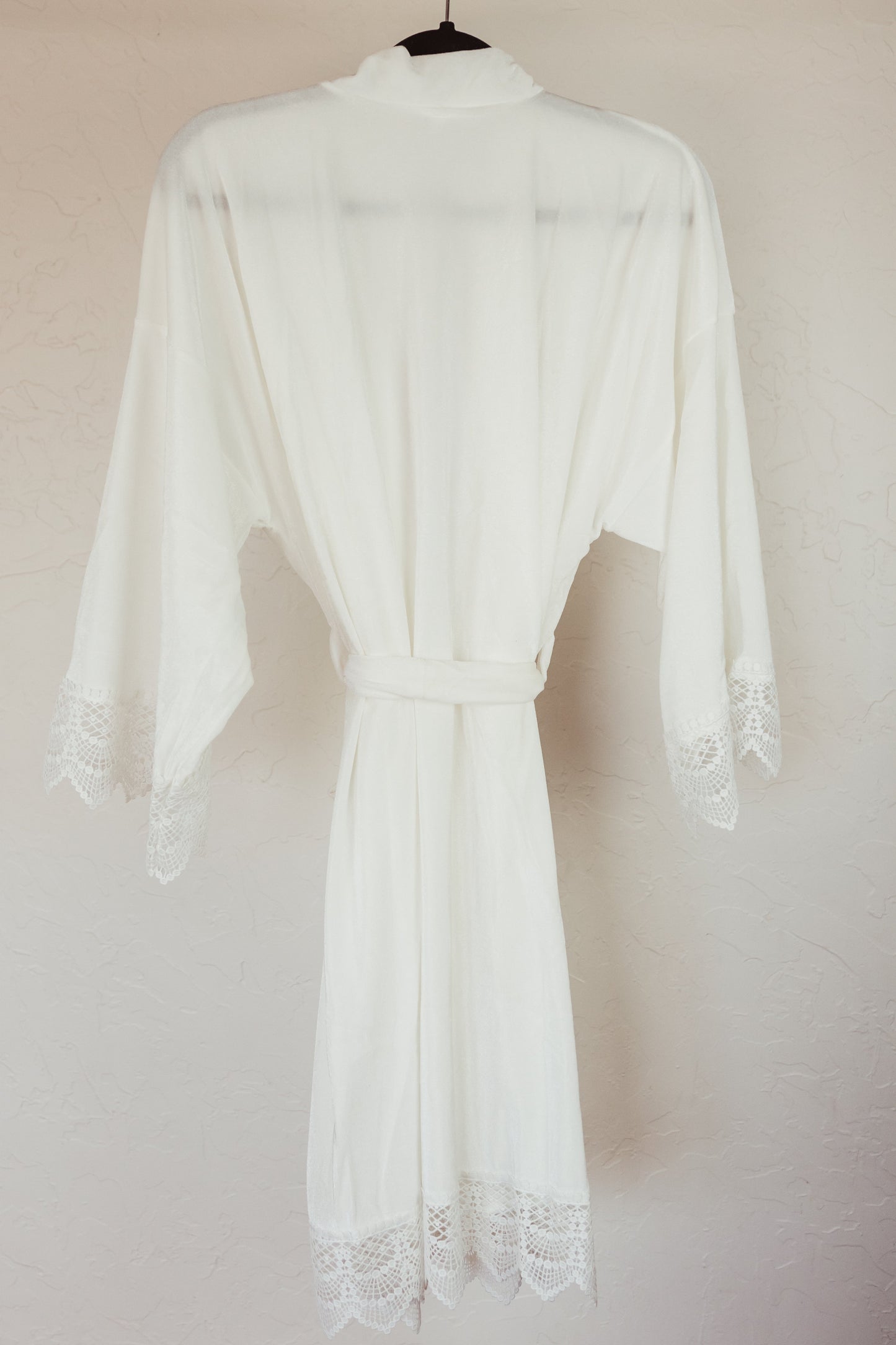 Soft velvet robe with lace sleeve accents, designed to pamper the bride on her special day