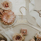 Elegant acrylic wedding dress hanger with gold name, perfect for bridal photos