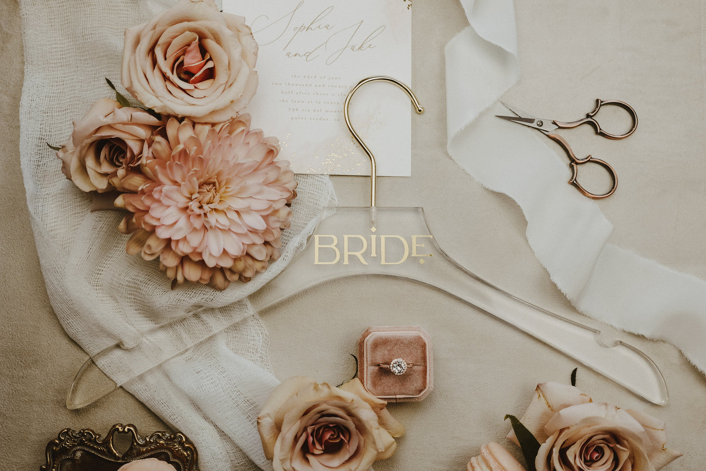Elegant acrylic wedding dress hanger with gold name, perfect for bridal photos