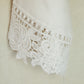 Close Up of Bride Getting Ready Robe in White with Floral Lace Detail on the Sleeves