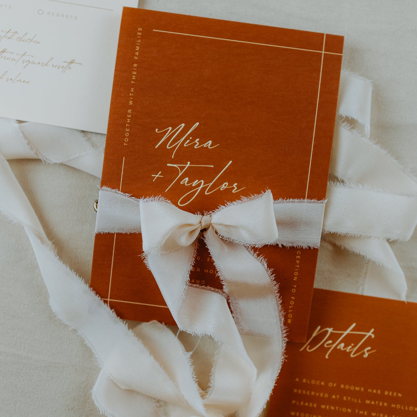 Hand-dyed silk ribbon with a raw edge, used to tie a wedding bouquet, also shown in a styled flat lay