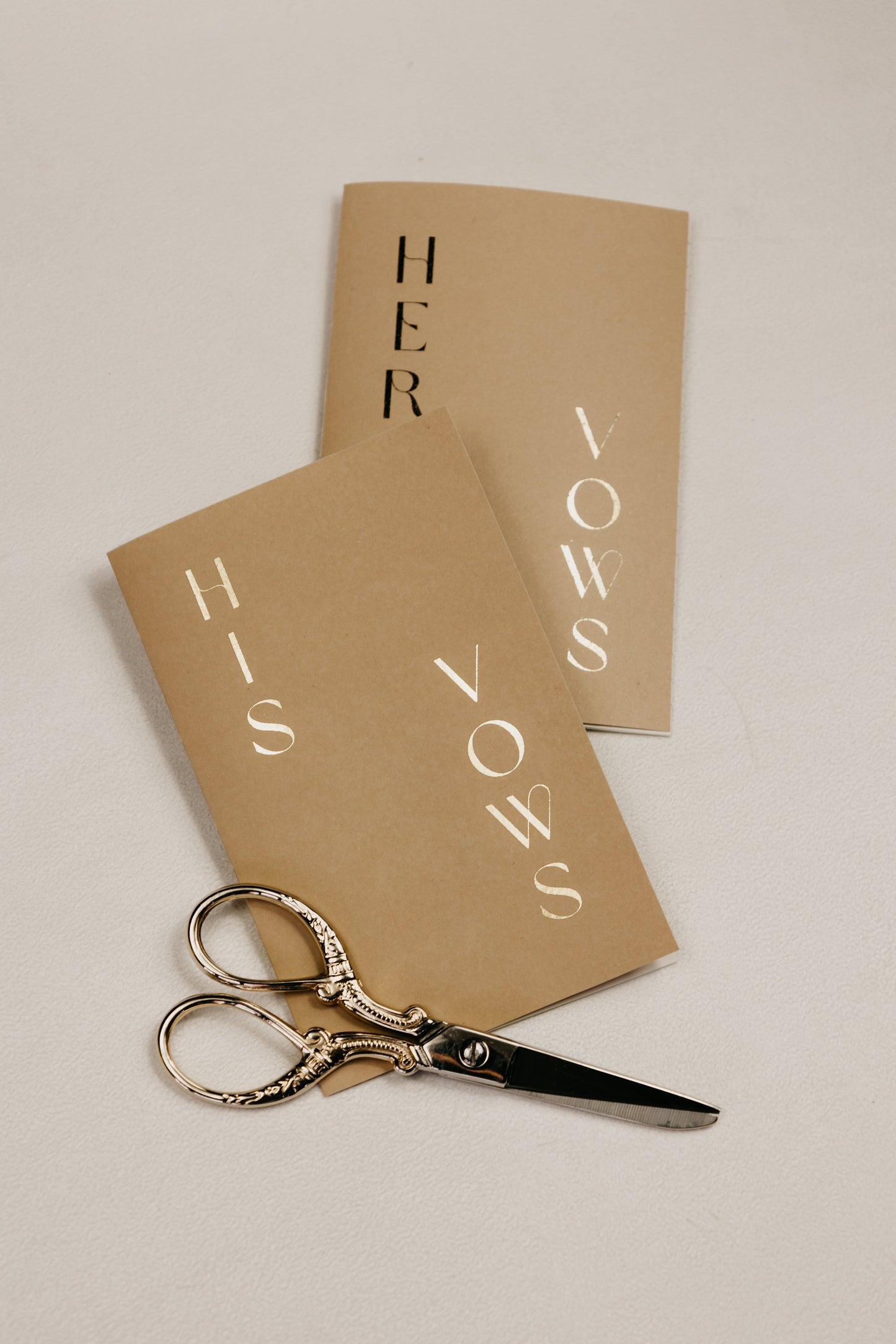 Handmade, pocket-sized vow books (3.5"x5.5") with foiled personalization, including names and wedding date, soft touch cover