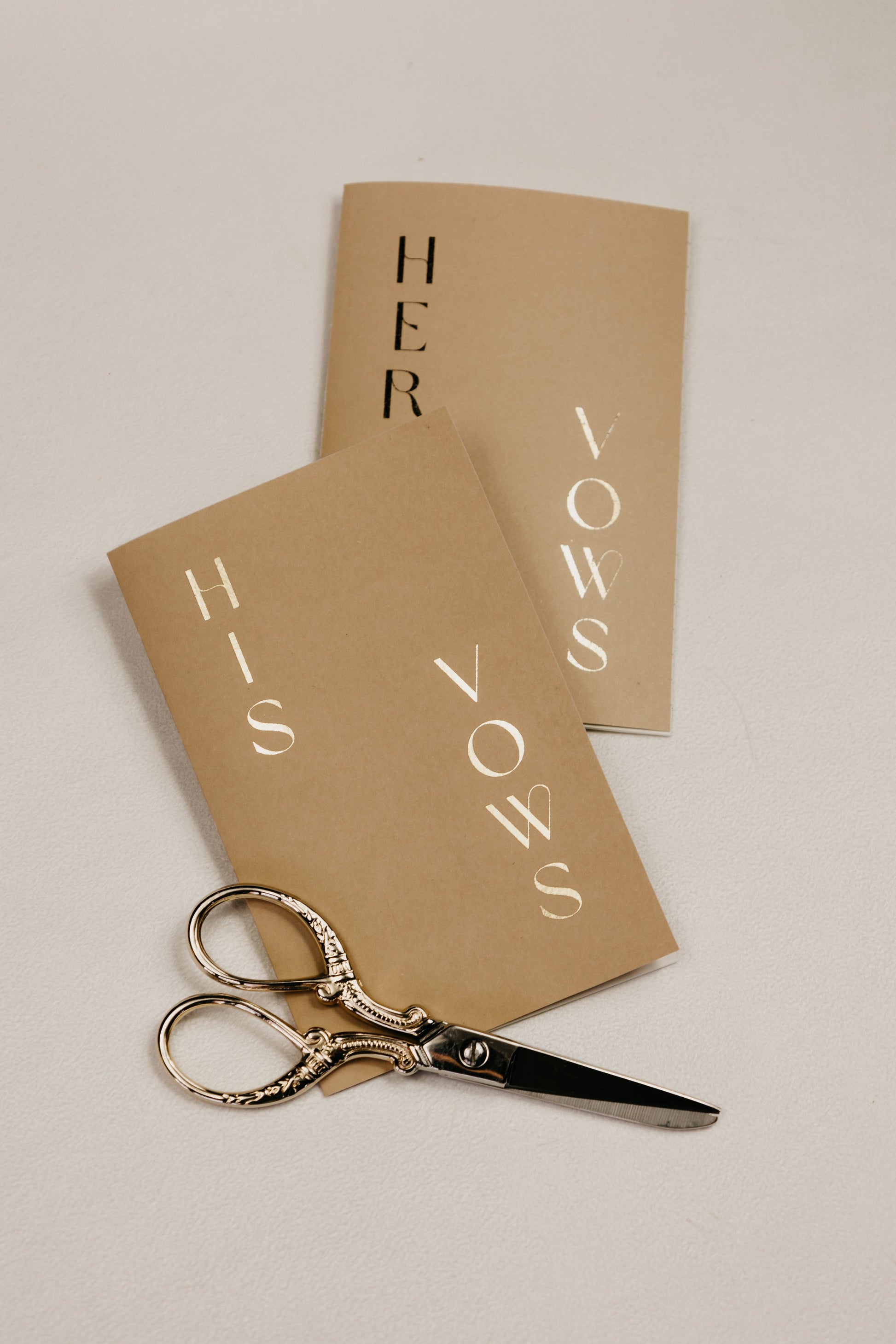 Handmade, pocket-sized vow books (3.5"x5.5") with foiled personalization, including names and wedding date, soft touch cover
