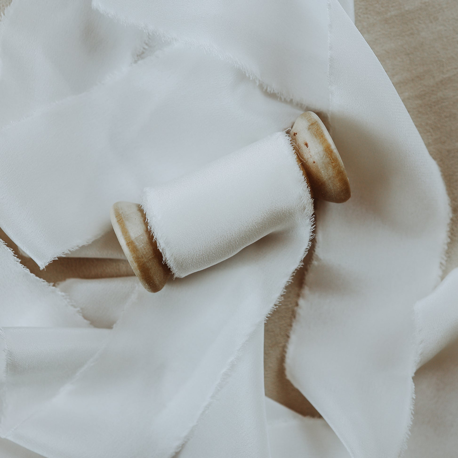 Raw edge silk ribbon, hand-dyed, perfect for styling wedding ring displays in flat lay photography, showcasing its natural beauty