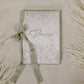 Write your wedding vows in a beautiful book covered with luxurious silver velvet