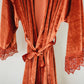 A sumptuous velvet robe with lace accents, perfect for your bridal party to feel pampered and special