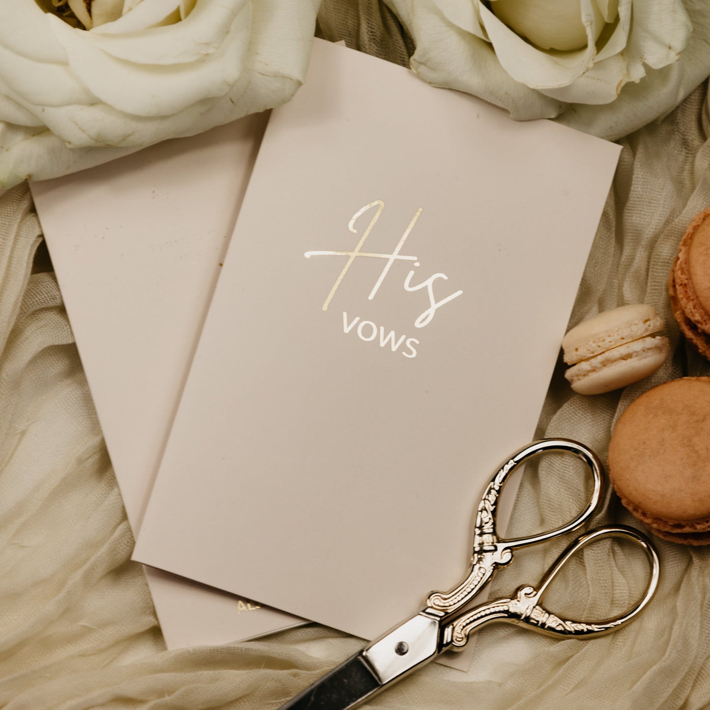 Close-up of a handmade vow book, showing the foiled personalization and soft touch cover, pocket-sized