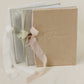 Vow books with velvet cover, 'vows' embossed, and ribbon tie, available in white, silver, champagne velvet and various ribbon colors