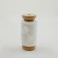 Handmade silk ribbon with a raw edge, used to create soft, flowing lines in bridal flat lay compositions